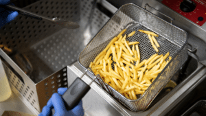 Fries being taken out of fryer